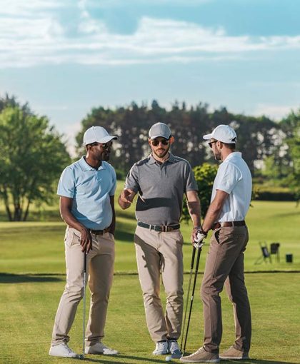multiethnic-group-of-golfers-holding-clubs-and-tal-2024-11-17-12-16-52-RJF44HK.jpg